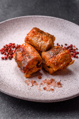 Hake fish cooked in pieces in tomato sauce, stew with peppers and carrots. Hake fish in tomato