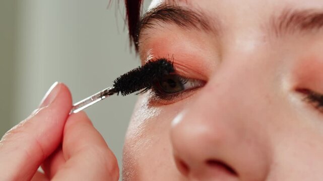 Beauty shot of woman makeup artist applying foundation bb cream on previously applied moisturizing young woman face close-up. Concept of skincare, cosmetics, make up, beauty