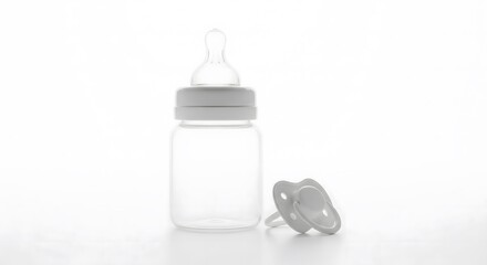 Isolated Baby Feeding Bottle and Pacifier on White Background