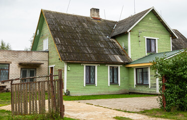 Green wooden house in Varnja village, Estonia.