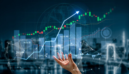 A modern hand reaching out toward digital graphs displaying rising financial trends, symbolizing investment growth, success, and the future of technology in finance. Scalp