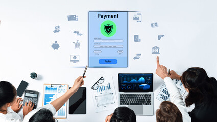 A diverse team of professionals discusses digital payment solutions while analyzing data and trends in a modern office environment to enhance financial security. Trope