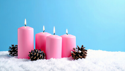 Pink advent candles burning on snow