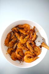 Fried shrimps and langoustines on a plate. Close-up of fried shrimps and langoustines.