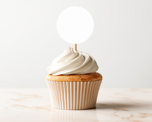 Cupcake with white frosting and blank mockup topper