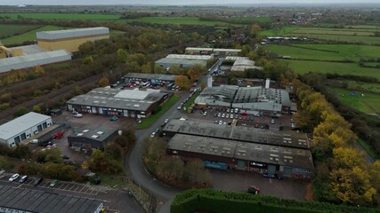 Aerial drone view of industrial warehouses, data centres and distribution factories in Loughborough, UK - Powered by Adobe