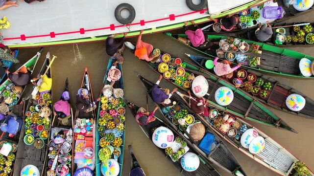 Floating market in Indonesia, Lok Baintan floating market, buyers and sellers by boat. Aerial view of traditional floating market in Indonesia