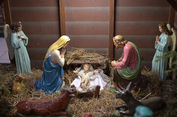 Traditional Christmas nativity scene with Mary and Joseph and baby Jesus in the manger.