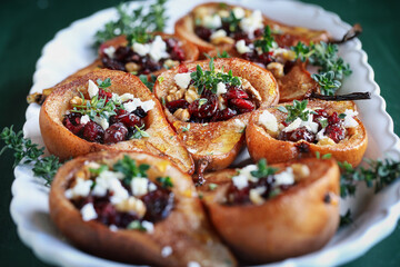Baked pears. brushed with olive oil and seasoned with some cinnamon. Bake at 375f or 180c degrees for 25 minutes, removed from oven. Add feta cheese, cranberries, walnuts. Garnish with honey and thyme