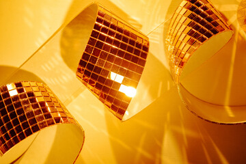 Abstract sparkling golden background with mirror mosaic tiles. High energy disco party banner background for promo and holidays.