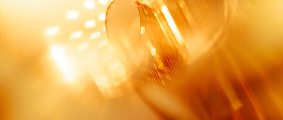 Abstract glossy golden banner panoramic background with copy space for discounts Christmas and New Year campaigns.