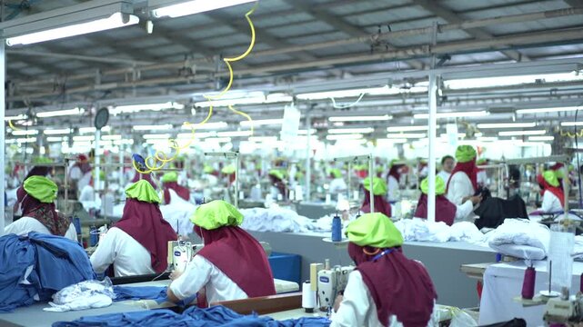 Sewing machine factory crowded Factory employee. Worker activity in a textile factory. factory worker sewing gloves using modern sewing machines