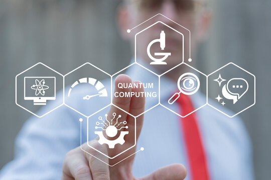 Quantum computing the future of information technology. Business person using virtual touch screen presses the words QUANTUM COMPUTING.