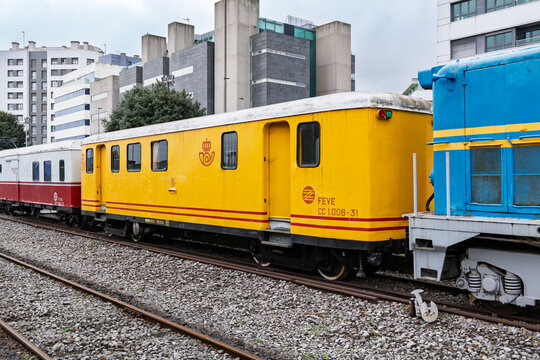Gijon, Spain &ndash; Old FEVE mail wagons from the Spanish postal service Correos, preserved as historical railway relics showcasing industrial and transport heritage.
