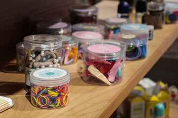 Clear Jars of Colorful Rubber Bands and Hair Accessories