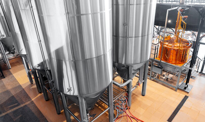 Industrial brewery factory with stainless steel fermentation tanks, top view