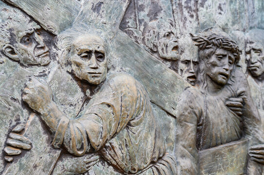 Station V: Simon of Cyrene helps Jesus carry the Cross. The Way of the Cross on Mount Križevac (the Cross Mountain) in Medjugorje.