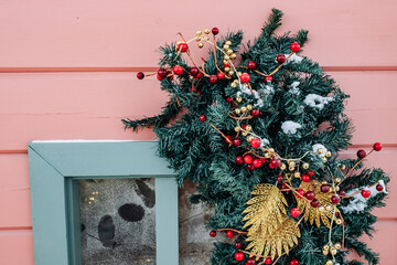 Christmas tree and New Year decorations on the town square on a frosty winter day.