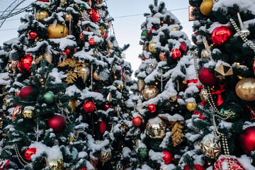 Christmas tree and New Year decorations on the town square on a frosty winter day.