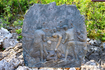Station IX: Jesus falls for the third time. The Way of the Cross on Mount Križevac (the Cross Mountain) in Medjugorje.
