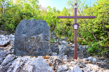 Station IX: Jesus falls for the third time. The Way of the Cross on Mount Križevac (the Cross Mountain) in Medjugorje.