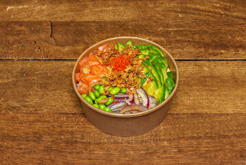 A typical salmon poke bowl with avocado, red onion, and edamame inside a circular cardboard bowl