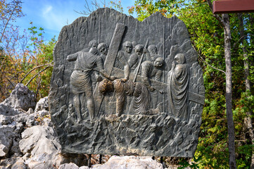 Station III: Jesus falls for the first time. The Way of the Cross on Mount Križevac (the Cross Mountain) in Medjugorje.