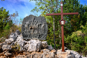 Station III: Jesus falls for the first time. The Way of the Cross on Mount Križevac (the Cross Mountain) in Medjugorje.