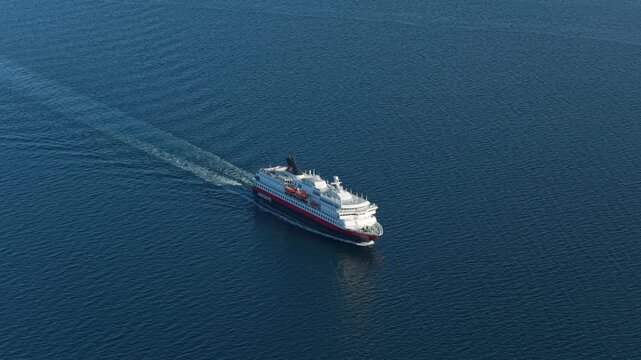 Hurtigruten ship seen from above in daylight, cruising Norwegian sea