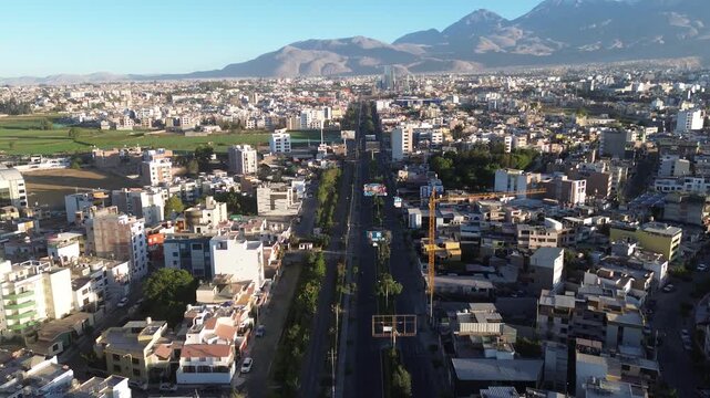 Aerial shot of Arequipa city, Peru, with the Chachani volcano in the background &ndash; panoramic drone view over the districts of Cerro Colorado and Yanahuara under a clear sky