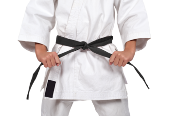 Martial artist in white kimono holding black belt.
