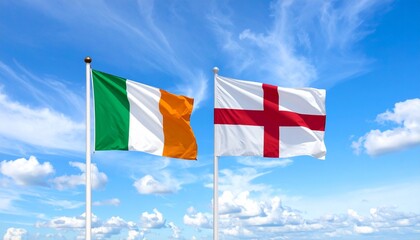 Two flags flying on flagpoles against a bright blue sky