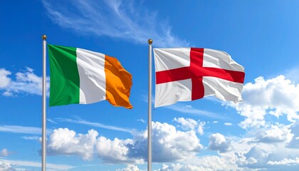 Two flags flying on flagpoles against a bright blue sky