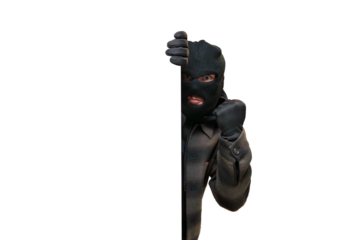 Balaclava-clad man showing clenched fist, representing crime, danger, and hidden threats peeking from empty space