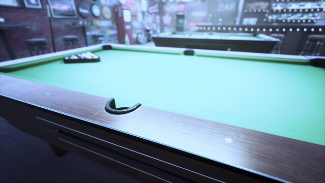 A lively pool hall, filled with energy, shows a close up view of a green felt pool table waiting for players. Soft lighting enhances the inviting atmosphere of friendly competition.