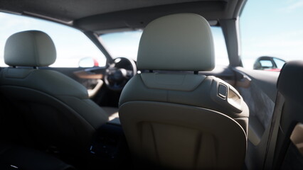 Fototapeta premium With a focus on comfort and technology, this scene offers a glimpse into the interior of a stylish car. The sleek design and soft seats provide a perfect driving experience.
