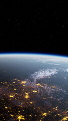 This stunning view captures the curvature of Earth from space, highlighting city lights glowing below and clouds drifting in the night sky, creating a breathtaking contrast against the darkness.