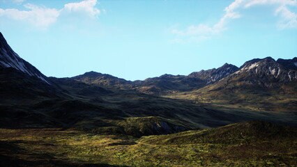 Rolling hills and majestic peaks stretch across the landscape, bathed in warm sunlight. The bright blue sky enhances the vibrant colors of the terrain, creating a peaceful scene of nature.