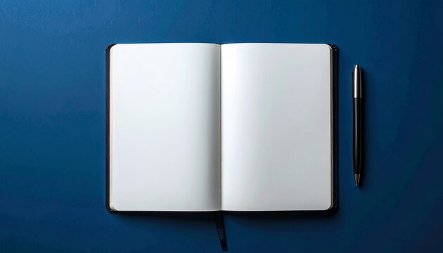 Top view of blank notebook with pen on dark blue background, minimal composition, mock-up