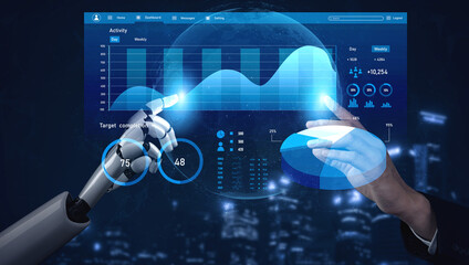 A futuristic interface depicts a human hand and a robotic arm interacting with data visualization...