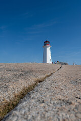 Peggys Cove, Canada - October 06, 2025: Peggys Point Lighthouse, also known as Peggys Cove Lighthouse, is an active lighthouse and an iconic Canadian image.