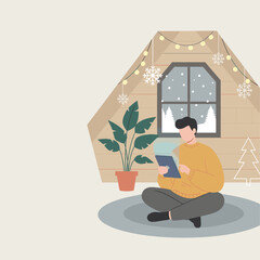 Cozy man uses tablet indoors during snowy winter holiday Digital communication and relaxation