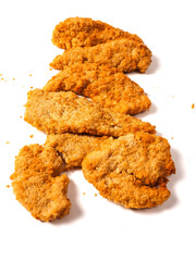Uncooked chicken goujons or tenders in on white background. Popular classic chicken dish made from pieces of breast and breadcrumbs. Traditional ready to cook poultry product.
