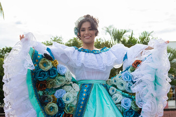 Portrait of a young Latina Colombian dancer looking at the camera in Neiva, Huila, Colombia. Concept of Colombian culture