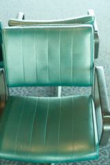 functional chair for customers in an airport terminal or bus station depot and passengers in waiting area with industrial seating leather wrapped bench