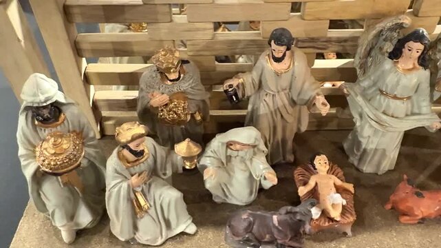 Complete nativity scene featuring figurines of baby jesus, mary, joseph, the three wise men, and an angel. Traditional christmas decoration representing the birth of jesus christ in bethlehem