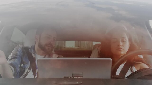 Woman holding hands on the steering wheel, studying to drive. Slow motion