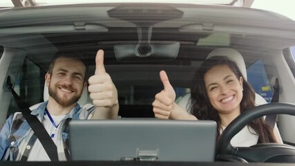 Happy lady enjoying drive during driving lesson with instructor. Slow motion
