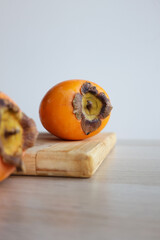 persimmon on a wooden table