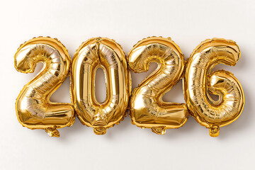 Shiny gold balloons in the shape of numbers "2026" on a white background